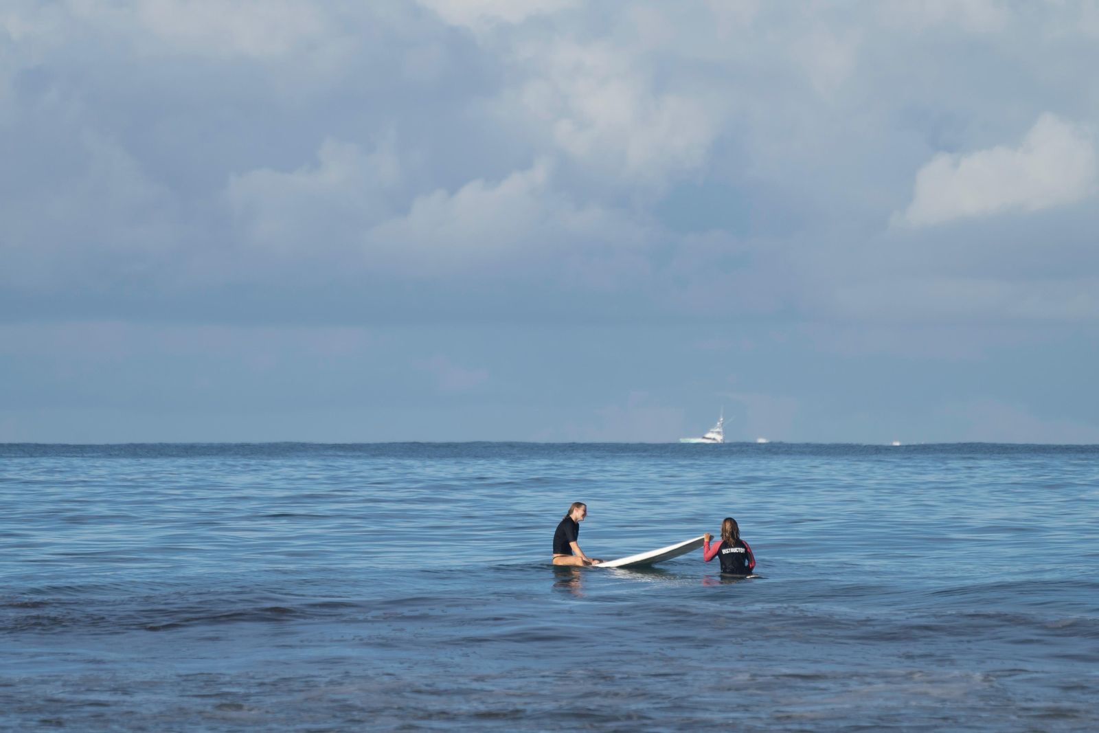 Waiting for a wave together out in the lineup